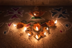 9 Lamps on Rangoli and Kolam Powder